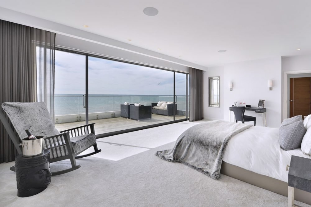 Residential Interior Design Photography of bedroom overlooking sea.